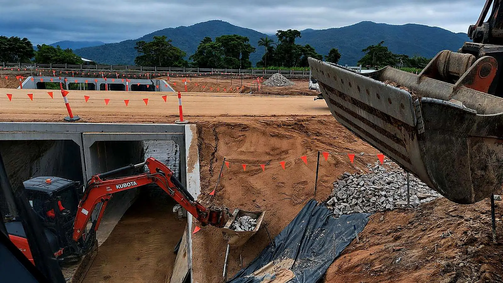 AreeCivil Constructions excavation and concrete culvert works Excavators undertaking earthworks beside a concrete culvert and drainage structure